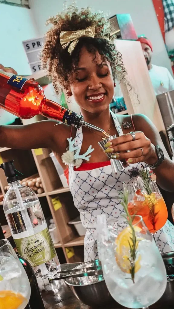 Pouring Aperol on a Spritz & Spaghetti Class