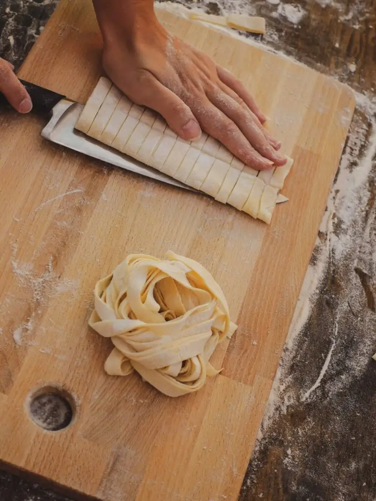 Plating a finished spaghetti dish