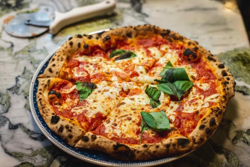 Neapolitan Pizza Margherita, the most typical types of Italian pizzam as photographed by Aurelien Lemasson Theobald