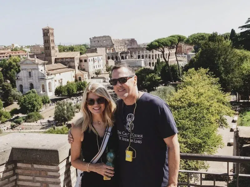 Couple on the Palatine Hill with the Colosseum in the background on a Private Colosseum Tour